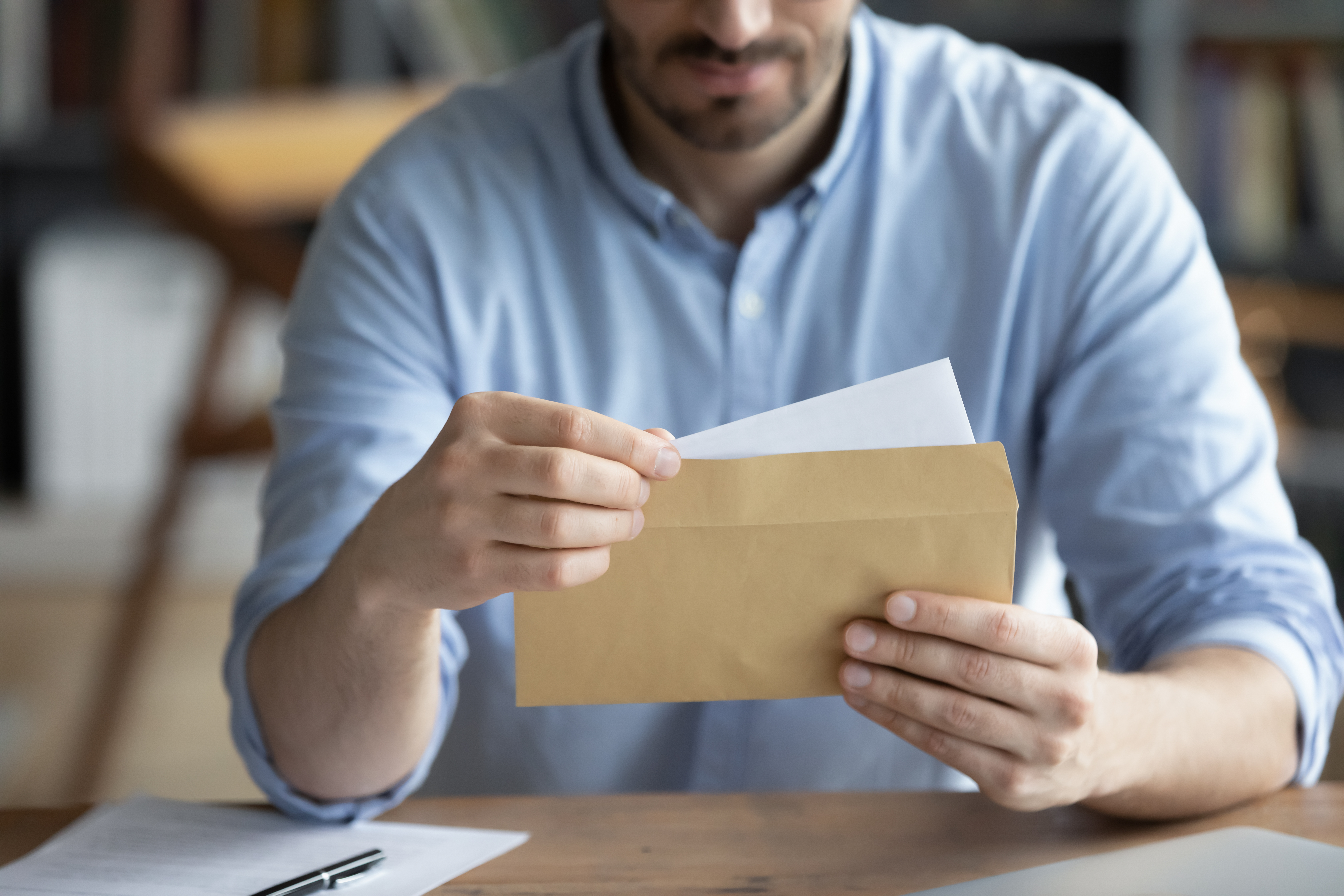Man Opening Document